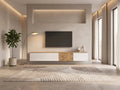 Meuble TV suspendu blanc WHOUS dans un salon moderne lumineux aux tons chauds, vue de face